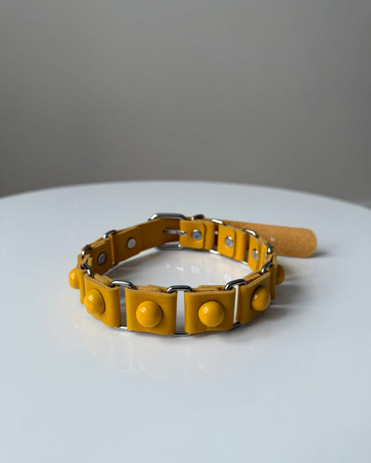 DOTDOTPOP yellow dome studded choker necklace with PU faux leather. Edgy and trendy design for streetwear and statement fashion.